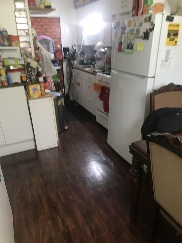 kitchen with white cabinetry, white appliances, and dark wood finished floors