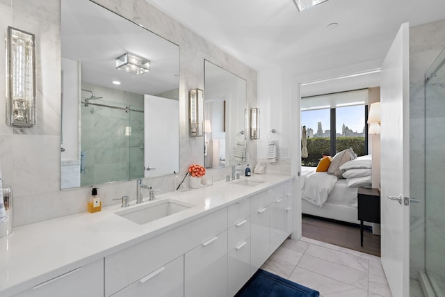 bathroom featuring walk in shower and vanity