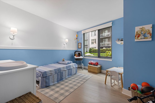 bedroom with light wood-type flooring