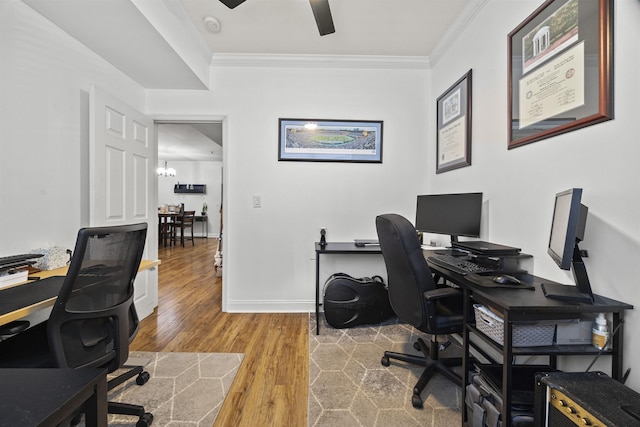 office area with ceiling fan with notable chandelier, crown molding, and hardwood / wood-style flooring