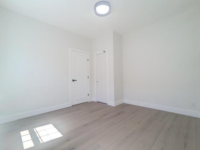 368 Palisade Ave, Jersey City, NJ 07307 - empty room with light wood-type flooring and baseboards