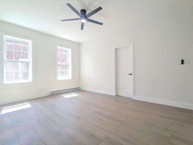 368 Palisade Ave, Jersey City, NJ 07307 - spare room featuring baseboard heating, wood finished floors, and baseboards