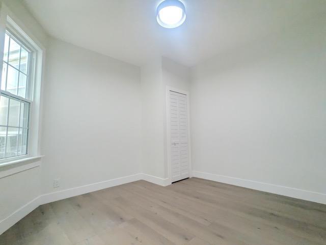 368 Palisade Ave, Jersey City, NJ 07307 - spare room with light wood finished floors and baseboards
