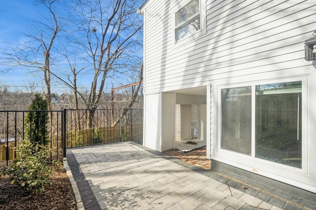 view of patio / terrace featuring fence