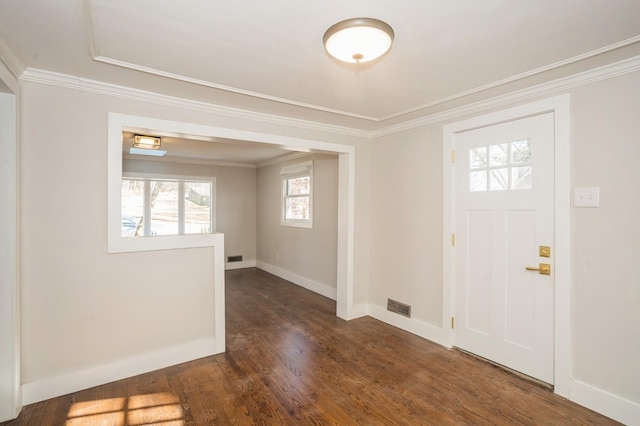 entrance foyer with visible vents, baseboards, dark wood-type flooring, and crown molding