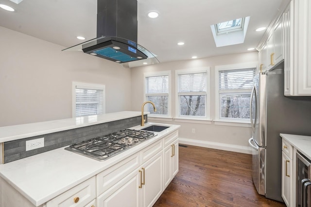 kitchen with recessed lighting, island exhaust hood, stainless steel appliances, a sink, and dark wood-type flooring