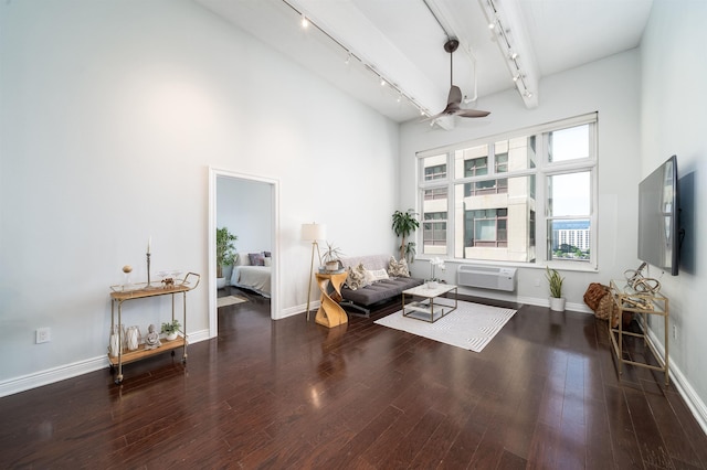 1500 Hudson St Unit 7U, Hoboken, NJ 07030 - living area with track lighting, a wall mounted air conditioner, ceiling fan, wood finished floors, and baseboards