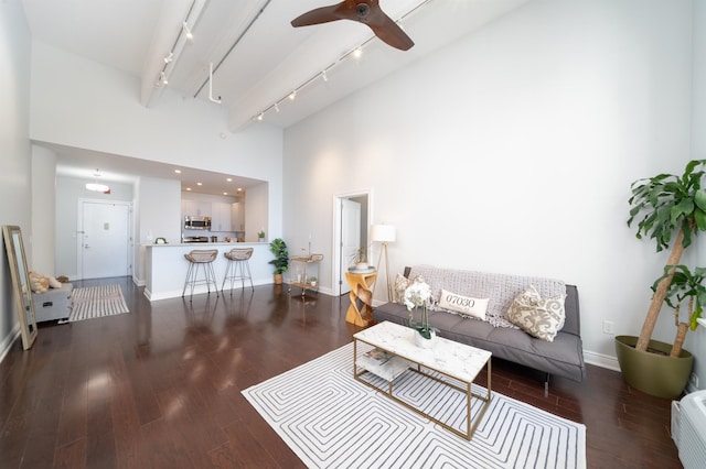 1500 Hudson St Unit 7U, Hoboken, NJ 07030 - living area featuring rail lighting, a towering ceiling, baseboards, and wood finished floors