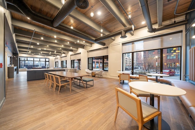 1500 Hudson St Unit 7U, Hoboken, NJ 07030 - dining area featuring light wood-style floors, wood ceiling with exposed beams, and baseboards