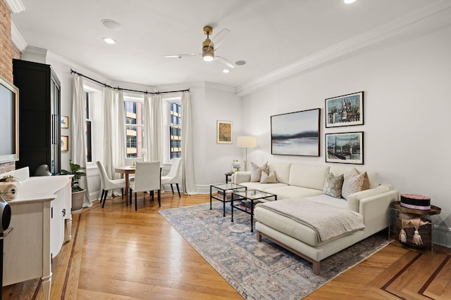living room featuring recessed lighting, ornamental molding, baseboards, and a ceiling fan