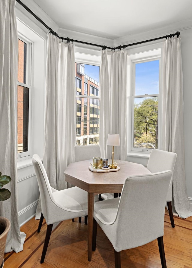 dining space featuring light wood-style flooring