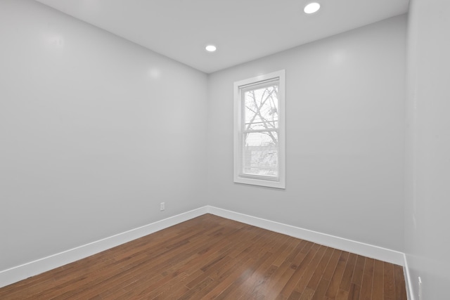 unfurnished room featuring hardwood / wood-style flooring