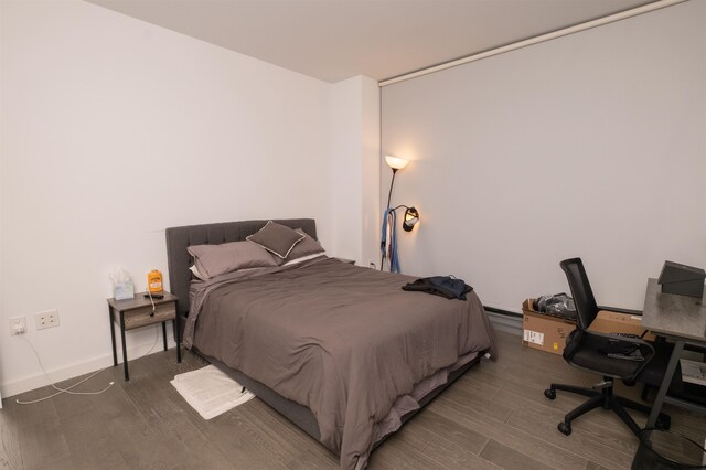 bedroom featuring wood finished floors