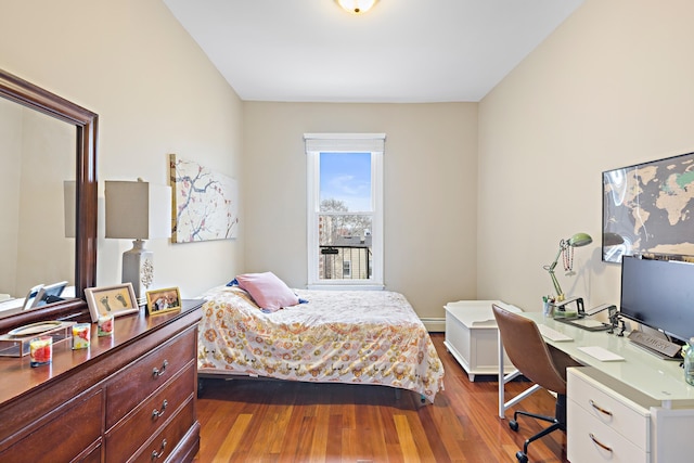 314 Palisade Ave Unit 3, Jersey City, NJ 07307 - bedroom with dark wood finished floors, an office area, and baseboard heating