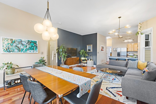 314 Palisade Ave Unit 3, Jersey City, NJ 07307 - dining room featuring a chandelier and light wood-style floors