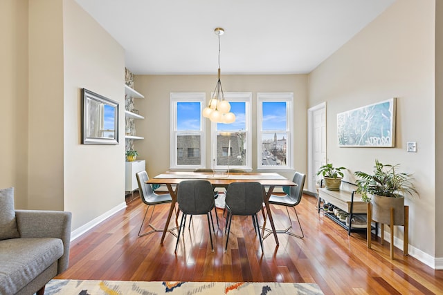 314 Palisade Ave Unit 3, Jersey City, NJ 07307 - dining space featuring wood-type flooring, baseboards, and a chandelier