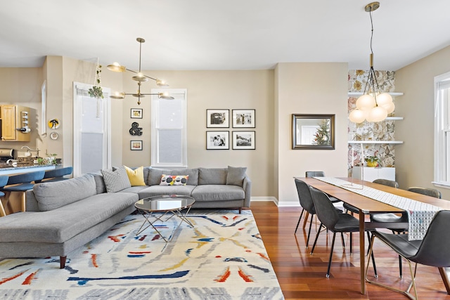 314 Palisade Ave Unit 3, Jersey City, NJ 07307 - living room with a chandelier, wood finished floors, and baseboards