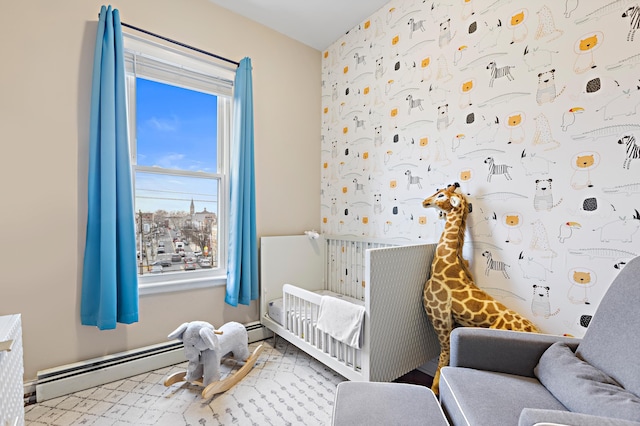 314 Palisade Ave Unit 3, Jersey City, NJ 07307 - bedroom with a crib and a baseboard heating unit