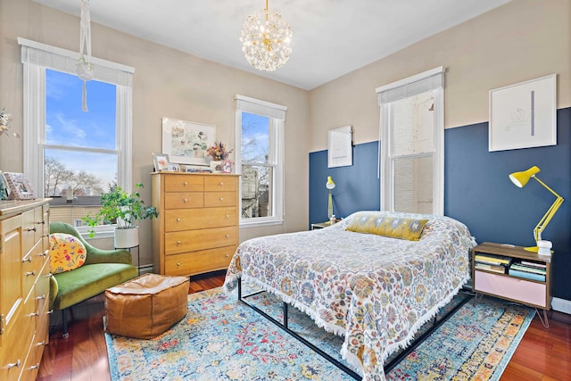 314 Palisade Ave Unit 3, Jersey City, NJ 07307 - bedroom featuring wood finished floors, a chandelier, baseboards, and baseboard heating