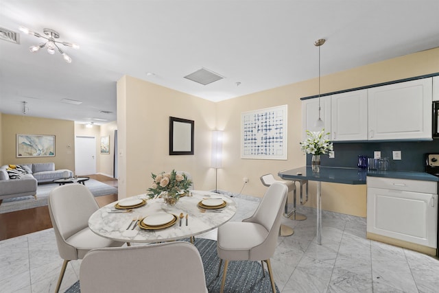75 Liberty Ave Unit E13, Jersey City, NJ 07306 - dining area featuring light marble finish floors
