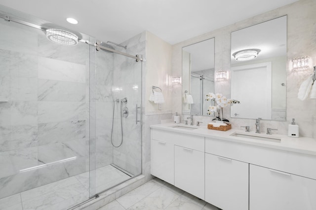 bathroom featuring walk in shower and vanity