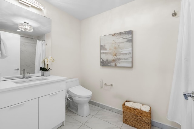 bathroom with toilet and vanity