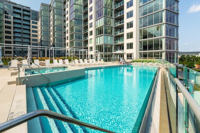 view of swimming pool featuring a patio area