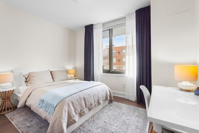 bedroom with hardwood / wood-style floors