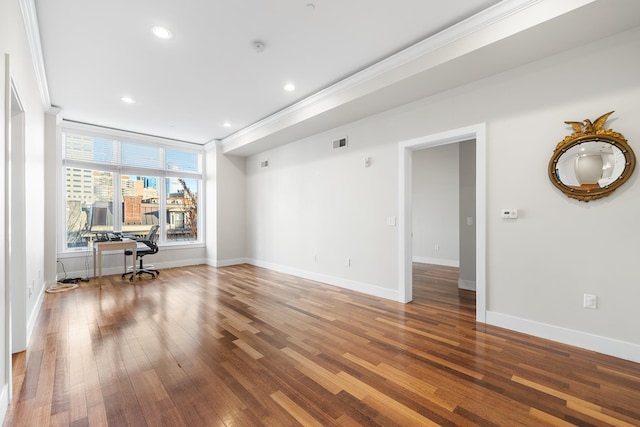 unfurnished room with dark hardwood / wood-style floors and ornamental molding