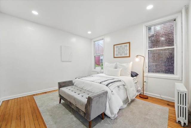 144 Nelson Ave, Jersey City, NJ 07307 - bedroom featuring radiator, light wood-style floors, baseboards, and recessed lighting
