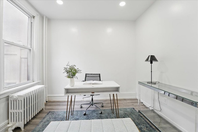 144 Nelson Ave, Jersey City, NJ 07307 - office featuring radiator heating unit, recessed lighting, wood finished floors, and baseboards