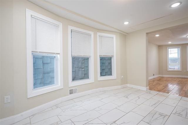 unfurnished room featuring recessed lighting, visible vents, marble finish floor, and baseboards