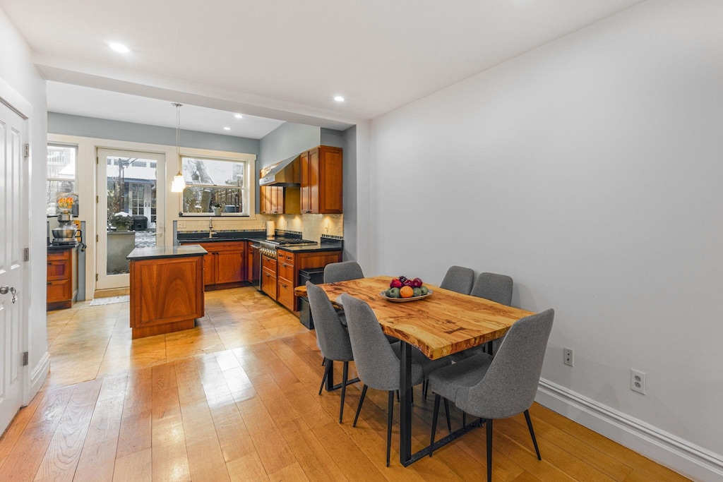 dining space featuring light wood-type flooring