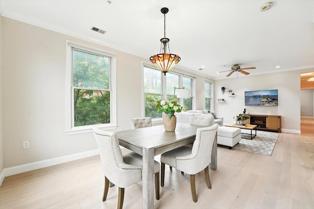 126 Dudley St Unit 315, Jersey City, NJ 07302 - dining area featuring light wood-type flooring, crown molding, and ceiling fan