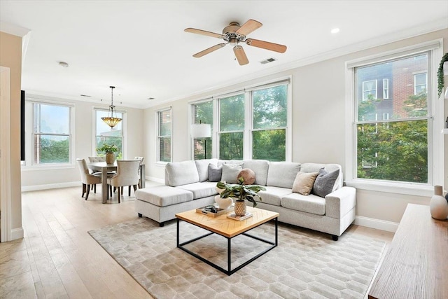 126 Dudley St Unit 315, Jersey City, NJ 07302 - living room featuring ornamental molding, light wood-style flooring, healthy amount of natural light, and ceiling fan