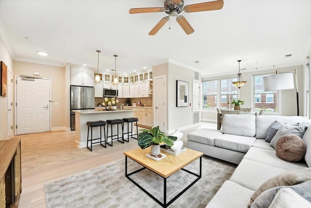 126 Dudley St Unit 315, Jersey City, NJ 07302 - living area featuring ornamental molding, recessed lighting, light wood-style floors, a ceiling fan, and a chandelier