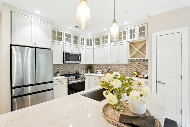 126 Dudley St Unit 315, Jersey City, NJ 07302 - kitchen with stainless steel appliances, light stone countertops, pendant lighting, decorative backsplash, and recessed lighting
