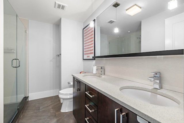89 Jefferson St Unit 2D, Hoboken, NJ 07730 - bathroom featuring double vanity, a stall shower, toilet, and baseboards