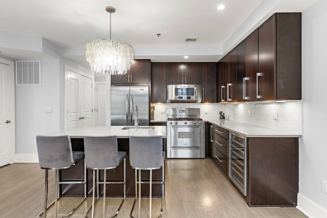 89 Jefferson St Unit 2D, Hoboken, NJ 07730 - kitchen with appliances with stainless steel finishes, light wood finished floors, baseboards, light countertops, and recessed lighting