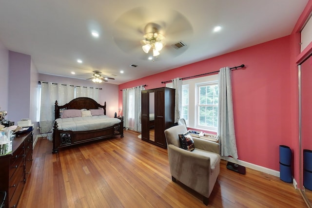 bedroom featuring ceiling fan and light hardwood / wood-style flooring