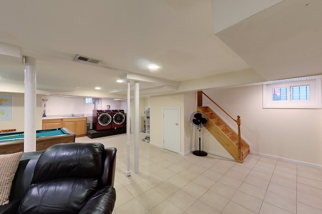 game room featuring pool table, light tile patterned floors, sink, and washer and dryer