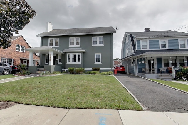 view of front of home featuring a porch and a front yard