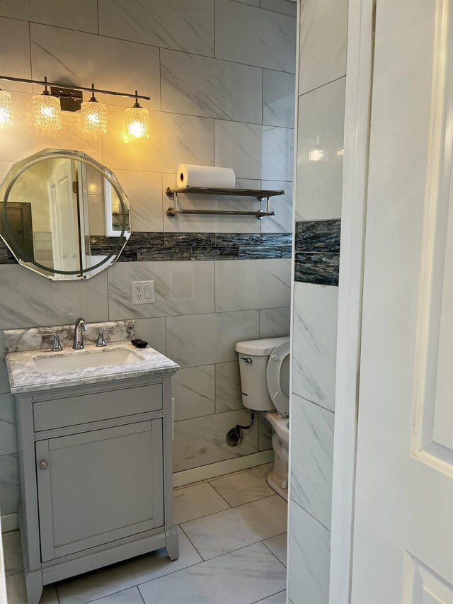 108 Palisade Ave Unit A5, Jersey City, NJ 07306 - half bathroom with vanity, marble finish floors, and tile walls