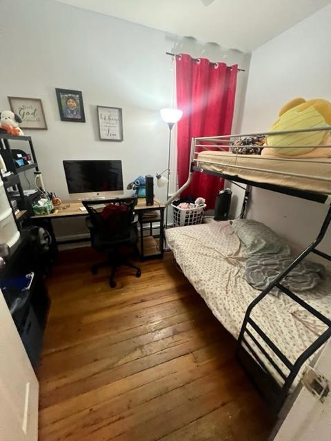 bedroom featuring wood-type flooring