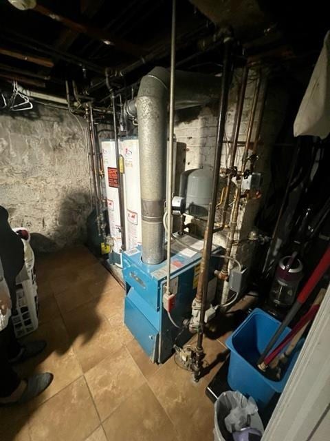 utilities featuring gas water heater and a heating unit