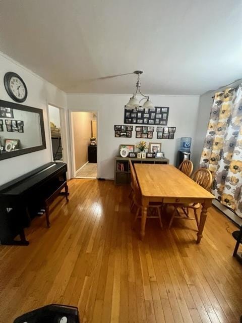 dining space with hardwood / wood-style flooring