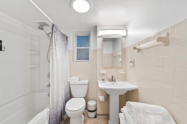 full bath with tile walls, shower / bath combination with curtain, visible vents, toilet, and tile patterned floors