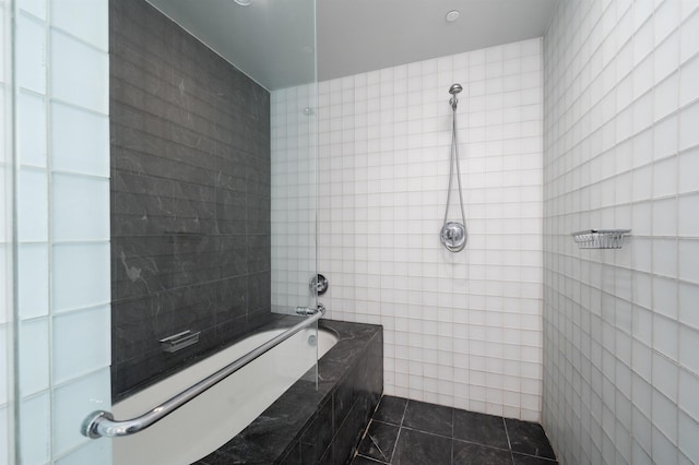 bathroom with tile patterned flooring, separate shower and tub, and tile walls