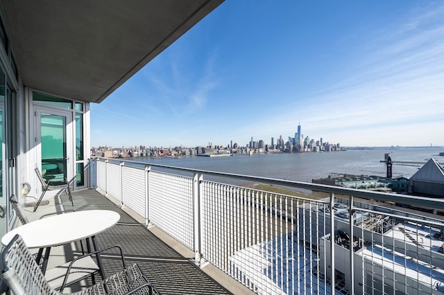 balcony featuring a water view