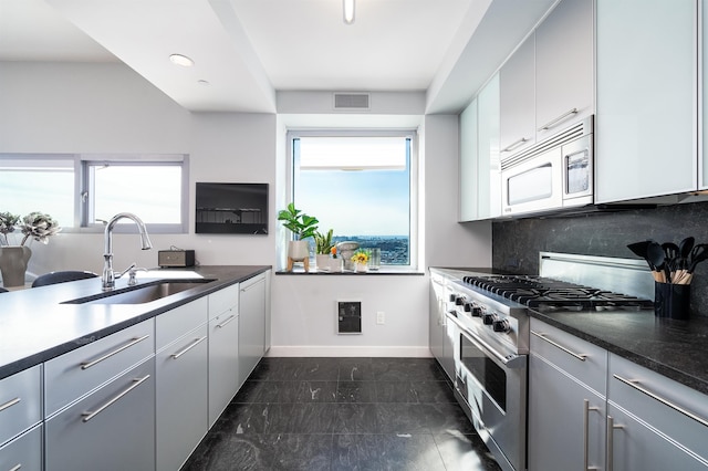 kitchen with white cabinets, gray cabinets, white appliances, and sink